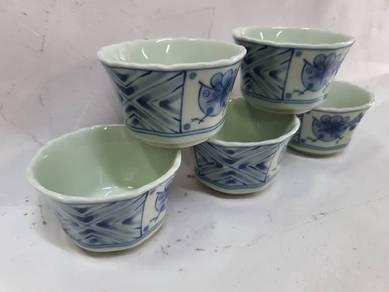 Set of five ceramic teacups.