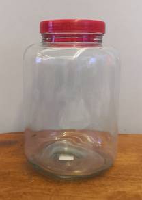large glass bottle red plastic lid