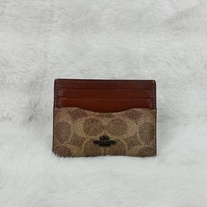 Coach card holder in signature canvas brown