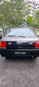 Proton Iswara S in Paya Terubong, PNG