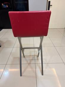 Red upholstered cross-leg chair