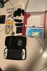 Nintendo Switch OLED (White) Bundle + 2 Games (Mar