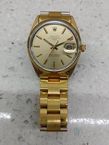 Rolex oyster perpetual gold date