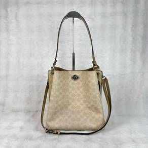 Coach Signature Charlie Bucket Bag in brown