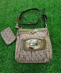 Dkny Original monogram full printed sling bag 