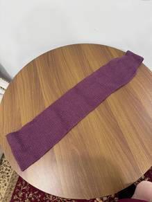 Purple knitted winter scarf
