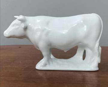 White ceramic cow statue
