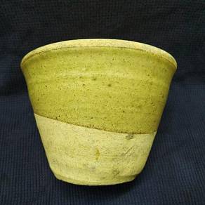 Old rubber cup (susu getah cawan)