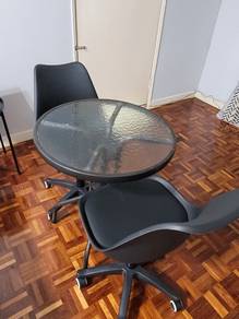Black adjustable chair woth table