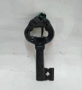 old iron bottle opener key shape