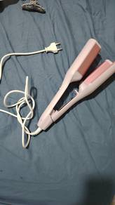 egg roll curling iron ( makes ur hair become wavy)