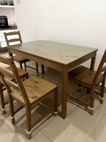 Ikea wooden table with glass top and four chairs