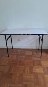Folding table with steel legs