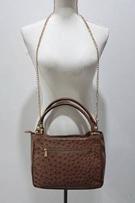 - Chic brown handbag with a luxurious ostrich leat