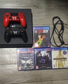 PS4 Slim 1TB with 2 controller's and 4 games 