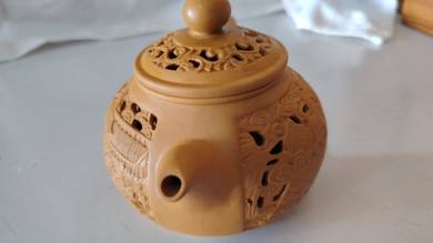 Openwork-carved clay teapot