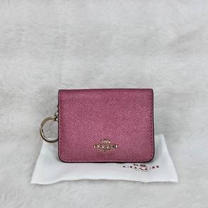 Coach keychain wallet in metallic dark pink