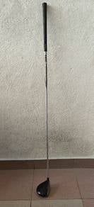 Golf putter and wood clubs.