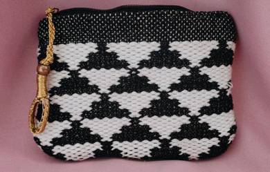 Seed wristlet or clutch