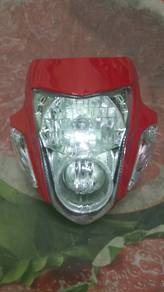 Honda Sonic 125 RS red headlight assembly.