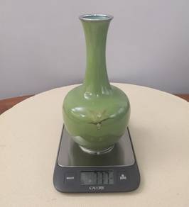 Signed green metal vase