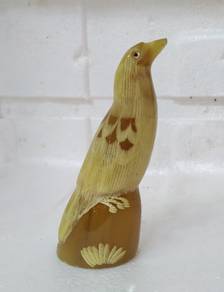 unique bull horn carved bird with black glass eyes