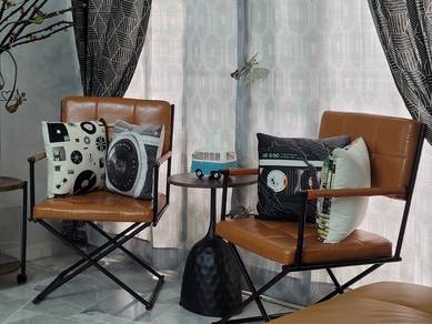 A pair of brown designer chair