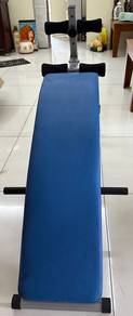 Lightly used curved sit-up and exercise bench