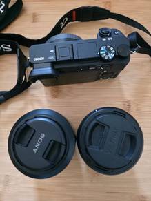 Sony A6400 + Sony E 50mm f/1.8 + Viltrox 25mm lens