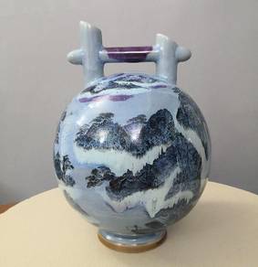 Pottery blue vase with holder