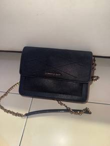 Charles and Keith black colour sling bag