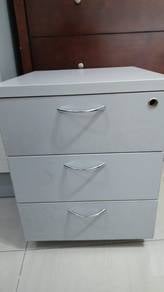 Side table with drawers on wheels