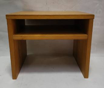 - Wooden side table
- Simple design
- Features a s
