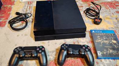 PS4 with controllers and games