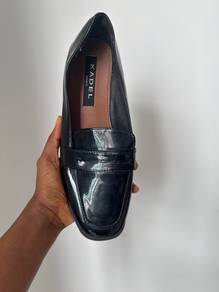 Black patent penny loafer flats”
