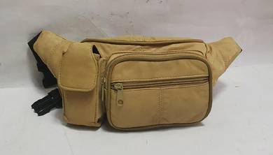 Tan leather fanny pack
- Multiple zippered compart
