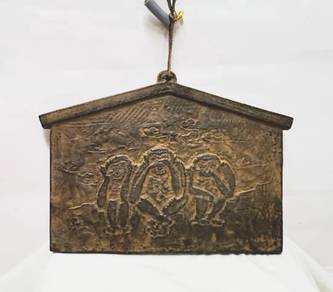 Vintage metal plaque featuring the iconic three wi