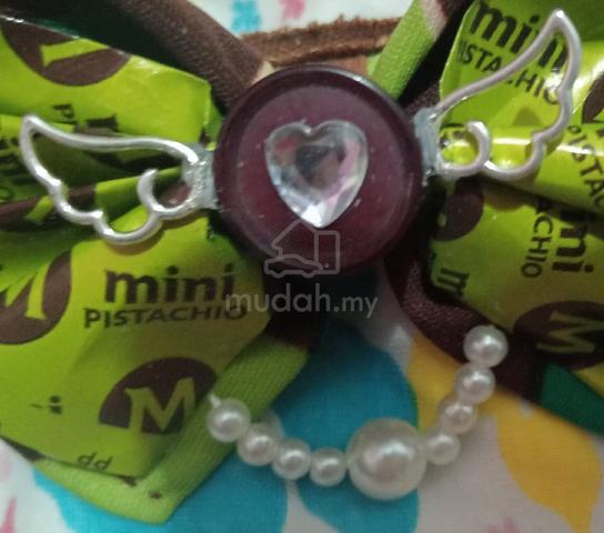 Handmade bow hairclips made by recycled materials  - photo 4 of 6
