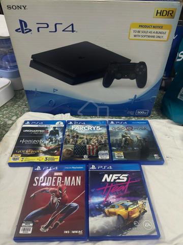 Selling a used PS4 Slim console + 5 game discs - photo 2 of 3