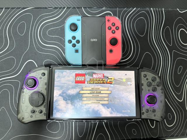 Nintendo switch oled 64gb + 128gb - photo 2 of 3